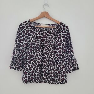Michael Kors animal print top with bell sleeves  off white, black and maroon. Sm